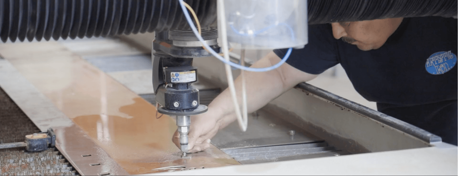 How does a waterjet cut steel?