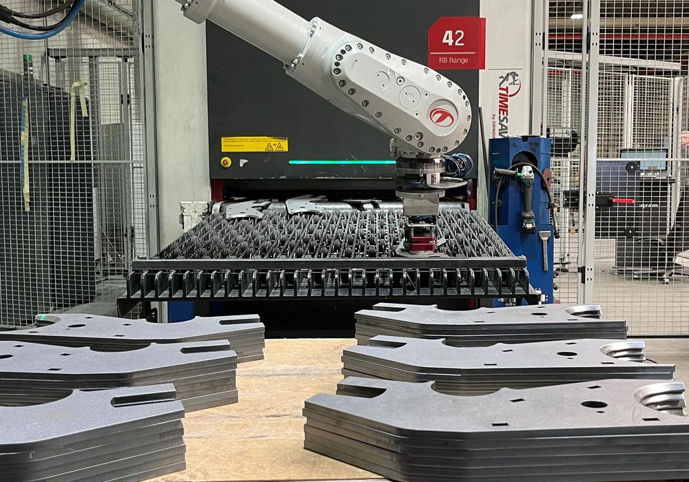 Timesavers sheet metal debarring and grinding robot are loading