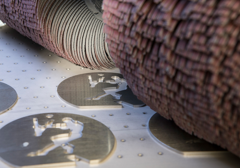 Deburring machines from Timesavers for linishing, wide belt metal grinding, precision grinding, and edge rounding of your metal parts. Achieve high quality, beautiful finishes.